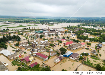 Aerial view of flooded houses with dirty water of Dnister river in Halych town, western Ukraine. Aerial view of flooded houses with dirty water of Dnister river in Halych town, western Ukraine. 134467281
