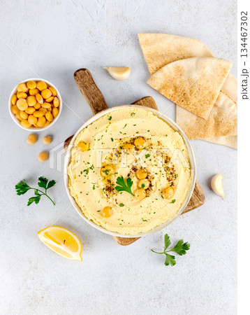 Lupin hummus with olive oil parsley, pita bread, garlic on white background Top view. Vegan food. 134467302