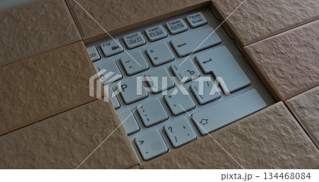 The command buttons and enter key in a hole of solid brickwork. Computers security illustration concept image  134468084