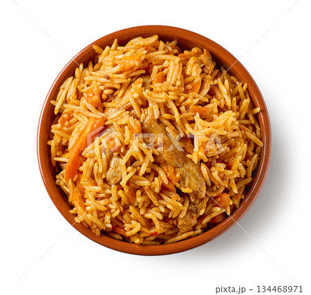 ceramic bowl of spicy rice with chicken meat and carrots isolated on white background 134468971