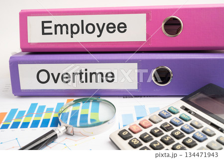 Employee, Overtime. Binder data finance report business with graph analysis in office. Employee, Overtime. Binder data finance report business with graph analysis in office. 134471943