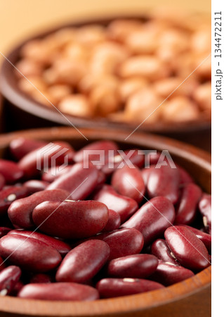 Raw red kidney beans in wooden bowl. Close-up 134472211