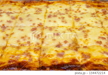 Cheese and slice ham lasagne on tray. Close up 134472214