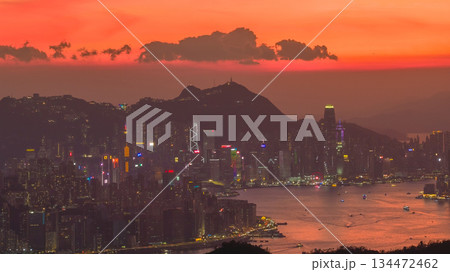 Vibrant Sunset Over a Bright City Skyline by the Harbor Nov 10 2025 134472462