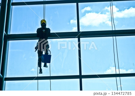 extreme work cleaning windows at height 134472785