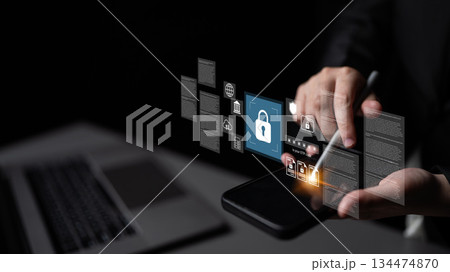 Hands Holding Smartphone with Security Icons and Digital Interface Elements Representing Cybersecurity and Data Protection Concepts Gantry Hands Holding Smartphone with Security Icons and Digital Interface Elements Representing Cybersecurity and Data Protection Concepts Gantry 134474870