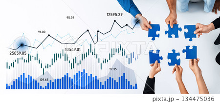 Team Collaboration on Business Strategy with Charts and Puzzles Representing Growth and Problem Solving in Modern Office Environment Scalp 134475036
