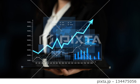 Businesswoman Presenting Data Visualizations with Growth Charts and Graphs on Tablet Against Dark Background for Financial Analysis and Reporting Scalp Businesswoman Presenting Data Visualizations with Growth Charts and Graphs on Tablet Against Dark Background for Financial Analysis and Reporting Scalp 134475056