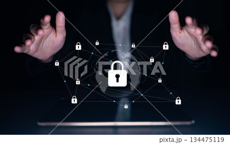 Hands of a business professional protecting a digital world with security locks and global connectivity concepts in a corporate environment at night Gantry 134475119