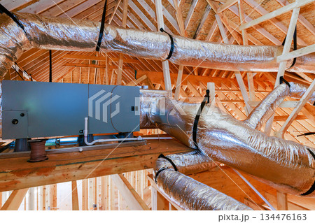 Workers install ventilation system in new building construction stage at residential area Workers install ventilation system in new building construction stage at residential area 134476163