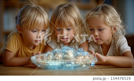 Three children amazed by glowing ship model 134476529