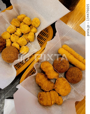 Crispy Korean fried chicken glazed with sweet and spicy sauce, paired with gooey, golden cheese balls. A perfect duo of bold flavor and melty indulgence in every bite. 134476605