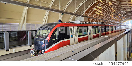 Light Rail Transit or LRT or rail transport system in Indonesia, modern metro train stationed at an urban platform, showcasing efficient public transport 134477992