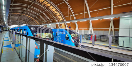 Light Rail Transit or LRT or rail transport system in Indonesia, modern metro train stationed at an urban platform, showcasing efficient public transport Light Rail Transit or LRT or rail transport system in Indonesia, modern metro train stationed at an urban platform, showcasing efficient public transport 134478007