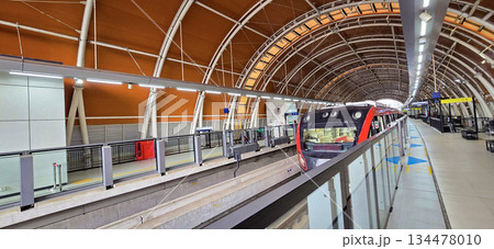 Light Rail Transit or LRT or rail transport system in Indonesia, modern metro train stationed at an urban platform, showcasing efficient public transport 134478010