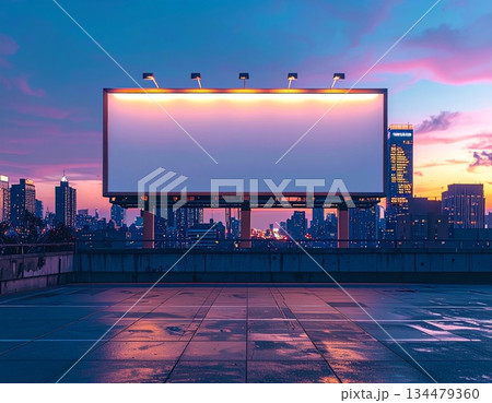 Blank Billboard Overlooking Cityscape at Dusk with Dramatic Sky Lighting Blank Billboard Overlooking Cityscape at Dusk with Dramatic Sky Lighting 134479360