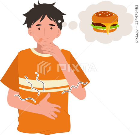 young man experiencing stomach ache and hunger while thinking about a burger young man experiencing stomach ache and hunger while thinking about a burger 134479463