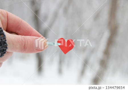 Creative winter background with blue paper heart. 134479654