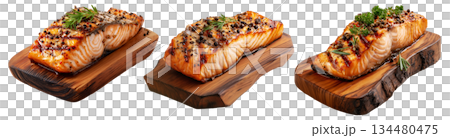 Grilled salmon steak topped with herbs and pepper, served on rustic wood board, isolated on white background, concept of seafood 134480475