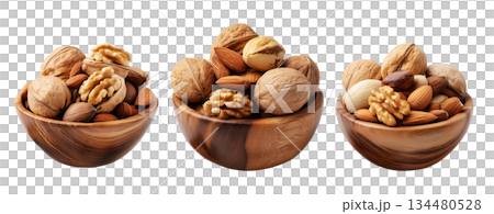 Assorted walnuts and almonds in natural wood bowl with some nuts floating above, isolated on white background 134480528