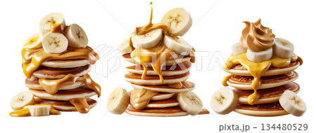 Stack of pancakes topped with banana slices and peanut butter splash isolated on white transparent background 134480529
