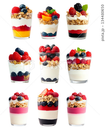 Set of Yogurt parfait with granola, raspberries, blackberries, and mint leaves in glass cup isolated on white background 134480650