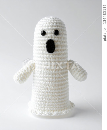 Handmade White Knitted Ghost with Black Oval Mouth on White Background High Key Lighting Handmade White Knitted Ghost with Black Oval Mouth on White Background High Key Lighting 134483153