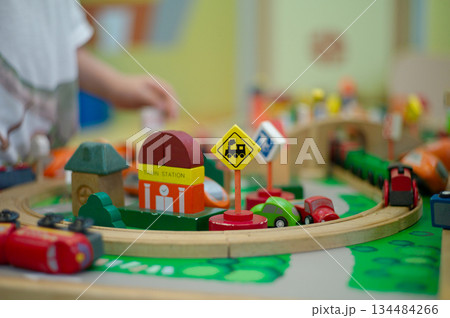 Wooden colorful toy in transportation concept comprised of train and cars. 134484266