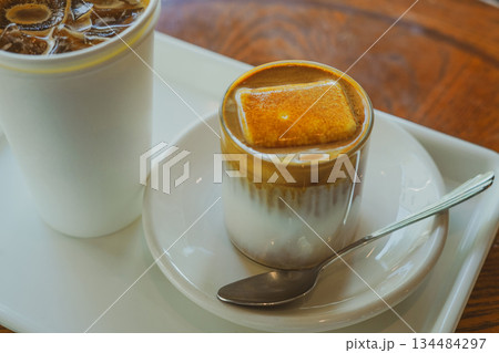 Cold Einspanner Latte Topped with Ice Cream and Cream Foam 134484297