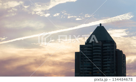 cityscape with clouds and sun 134484678