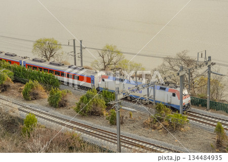 Scenic View of a Train Passing by Plum Blossom Trees at Sunmaewon, Yangsan, Korea Scenic View of a Train Passing by Plum Blossom Trees at Sunmaewon, Yangsan, Korea 134484935