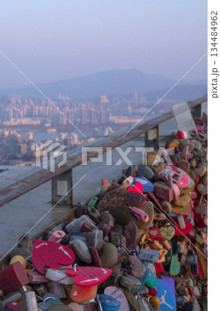 Seoul City Skyline Viewed Over the Railing Piled High with Numerous Love Locks at Namsan Tower Seoul City Skyline Viewed Over the Railing Piled High with Numerous Love Locks at Namsan Tower 134484962