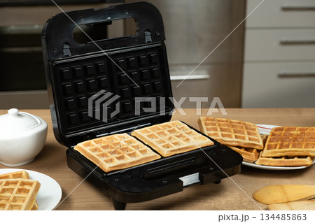 Homemade Belgian Waffles Ready to Be Served, Still in the Waffle Iron 134485863