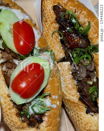 Delicious sandwich filled with fresh ingredients like crisp vegetables, tender meats, and savory spreads, all between two slices of soft bread. Perfect for a quick and satisfying meal. Delicious sandwich filled with fresh ingredients like crisp vegetables, tender meats, and savory spreads, all between two slices of soft bread. Perfect for a quick and satisfying meal. 134486223