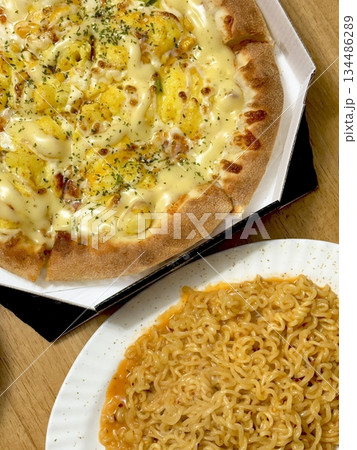 A delicious pizza with a golden crust, melted cheese, and savory toppings. Perfect for food-related designs, menus, or Italian-themed projects, capturing the essence of a classic comfort dish. A delicious pizza with a golden crust, melted cheese, and savory toppings. Perfect for food-related designs, menus, or Italian-themed projects, capturing the essence of a classic comfort dish. 134486289