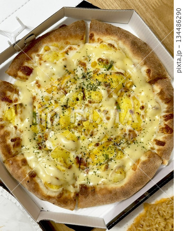 A delicious pizza with a golden crust, melted cheese, and savory toppings. Perfect for food-related designs, menus, or Italian-themed projects, capturing the essence of a classic comfort dish. 134486290