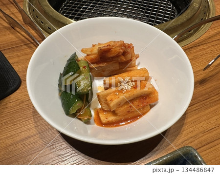 Crisp and juicy oi kimchi made with fresh cucumbers, chili flakes, and garlic seasoning. A refreshing Korean side dish with a spicy, tangy crunch perfect for summer meals. Crisp and juicy oi kimchi made with fresh cucumbers, chili flakes, and garlic seasoning. A refreshing Korean side dish with a spicy, tangy crunch perfect for summer meals. 134486847