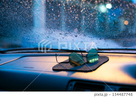raindrops on car window in car 134487748