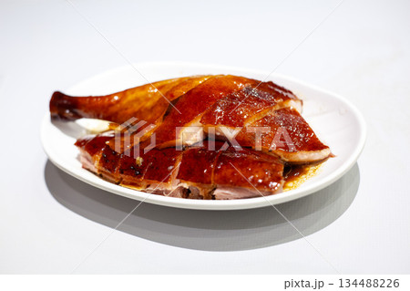 Hong Kong Cantonese style roast goose drumstick on white background Hong Kong Cantonese style roast goose drumstick on white background 134488226