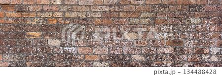 Old brick wall showing weathered masonry texture background Old brick wall showing weathered masonry texture background 134488428