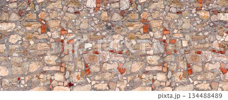 Old stone wall surface with varying textures Old stone wall surface with varying textures 134488489