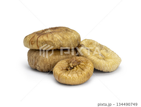 Pile of dried figs on a white background Pile of dried figs on a white background 134490749