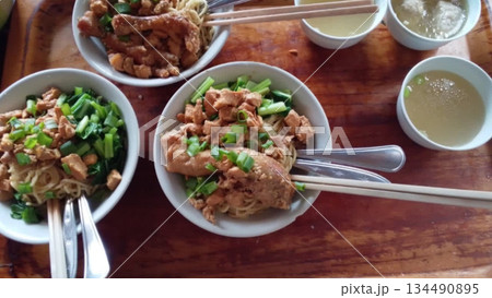 4k detailed Indonesian chicken noodles with chicken head topping 4k detailed Indonesian chicken noodles with chicken head topping 134490895