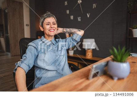 Relaxed Freelancer Enjoying a Break in Home Office 134491006