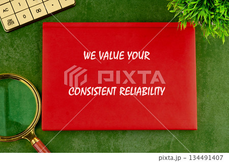 A crimson placard stating We Value Your Consistent Reliability rests on a vibrant green surface beside a magnifying glass, calculator, and a plant, suggesting business acumen and growth A crimson placard stating We Value Your Consistent Reliability rests on a vibrant green surface beside a magnifying glass, calculator, and a plant, suggesting business acumen and growth 134491407