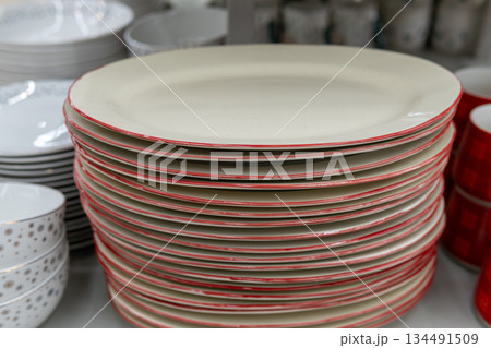 Stacked White Dinner Plates With Red Rim for Kitchen or Dining Tableware Stacked White Dinner Plates With Red Rim for Kitchen or Dining Tableware 134491509