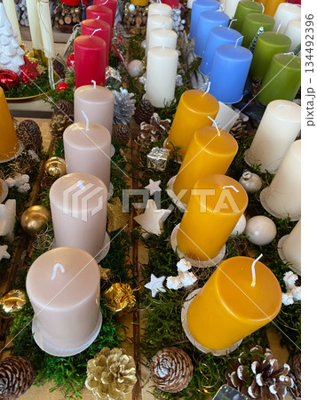 Vertical Close-up of Festive Candles and Ornaments for Holiday Season Decoration. 134492396
