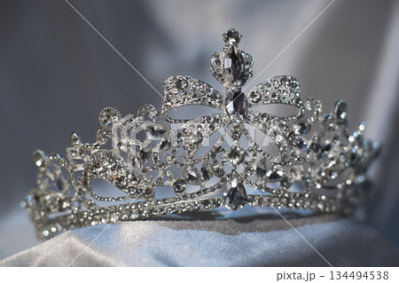 Luxury golden royal crown, diadem with bow detail. 134494538