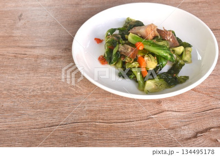 fried Brussels sprout or baby cabbage and crispy pork with soy sauce on plate fried Brussels sprout or baby cabbage and crispy pork with soy sauce on plate 134495178
