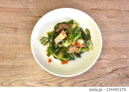 fried Brussels sprout or baby cabbage and crispy pork with soy sauce on plate  134495179